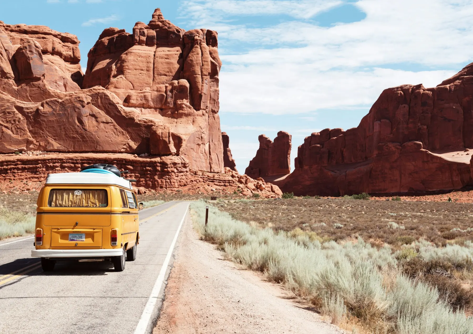Long arid road suggesting distance and sparse infrastructure